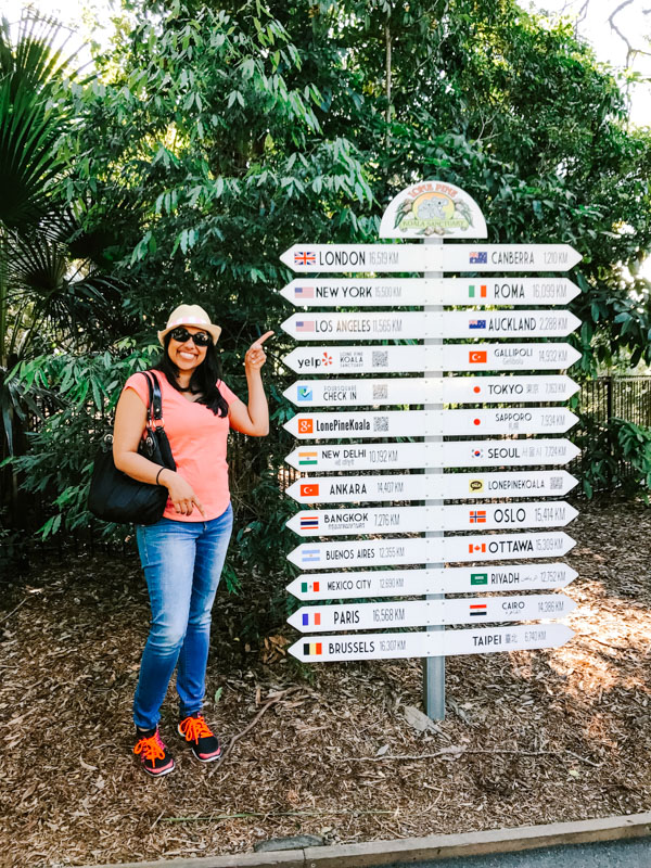 Aliya Bora at sign in front of Lone Pine Koala Sanctuary in Brisbane, Australia.