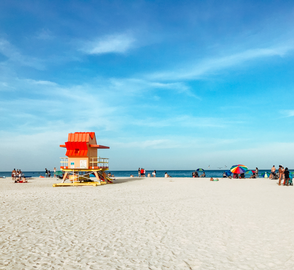 Red lifeguard tower on the sand at South Beach in Miami, Florida