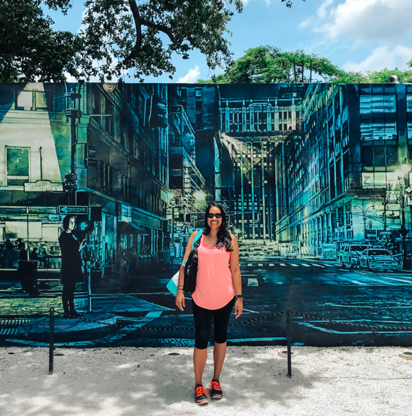 Aliya Bora in front of a mural at Wynwood Walls in Miami, Florida
