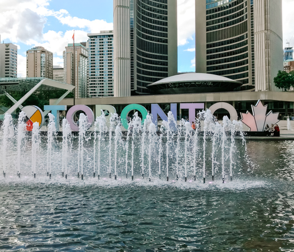 Fountain in the reflecting pool at Nathan Phillips Square in Toronto, Canada